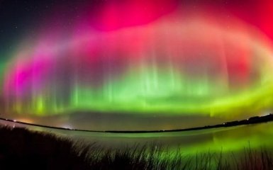 Північне сяйво на Землі зняли з космосу: яскраве відео