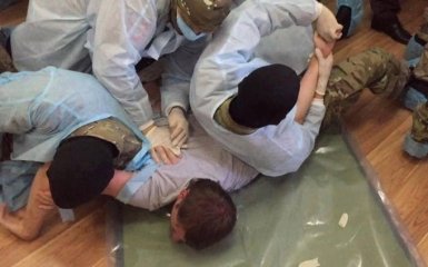 Разгорается скандал с избиением подозреваемых в деле Бузины: появились фото