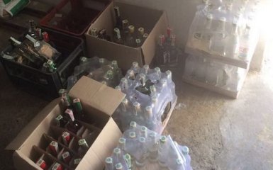 Вилучені тисячі пляшок спиртного: СБУ "накрила" нелегальне виробництво алкоголю в зоні АТО