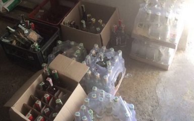 Вилучені тисячі пляшок спиртного: СБУ "накрила" нелегальне виробництво алкоголю в зоні АТО